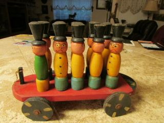 Antique Handmade Carved Wood Pull Toy With 10 Black Hat Dolls,  Hand Carved