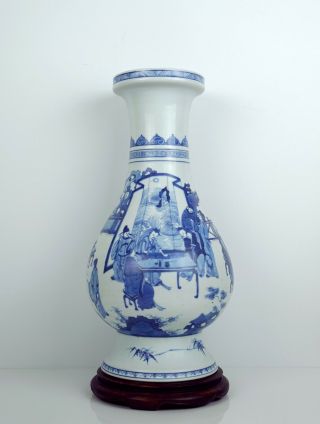 A Chinese Blue And White Vase With Stand
