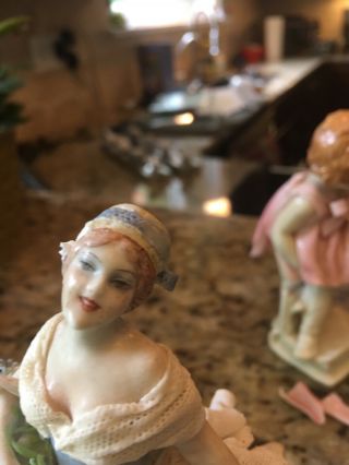 fabris porcelain figurine some broken lace,  finger appears to have been repaired 7