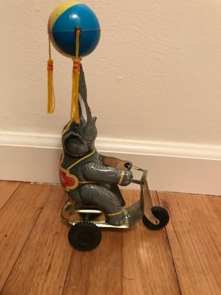 Vintage Tin Toy Wind Up Elephant On Tricycle Ball On Trunk 2 Tassels