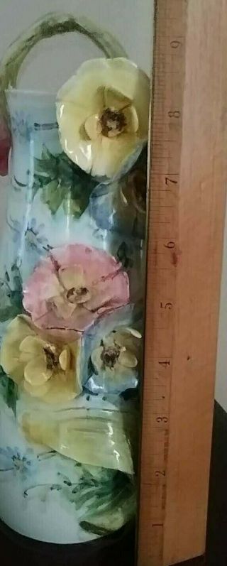 Vintage czechoslovakia vase with applied flowers and handle marked and numbered 2