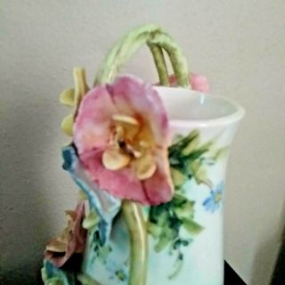 Vintage czechoslovakia vase with applied flowers and handle marked and numbered 3