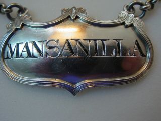 Unusual sterling silver decanter label incised for MANSANILLA,  a rare variant 2
