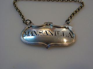Unusual sterling silver decanter label incised for MANSANILLA,  a rare variant 6