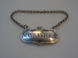 Unusual sterling silver decanter label incised for MANSANILLA,  a rare variant 7