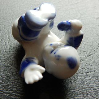 A rare & unusual Chinese blue and white porcelain figure of a baby 2