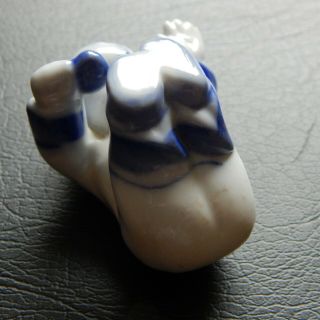 A rare & unusual Chinese blue and white porcelain figure of a baby 4