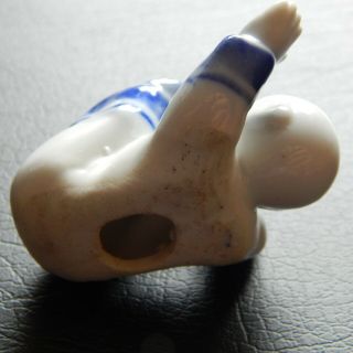 A rare & unusual Chinese blue and white porcelain figure of a baby 5