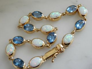 An Exceptional 9 Ct Gold 8.  00 Carat Opal And 7.  00 Ct Blue Topaz Bracelet