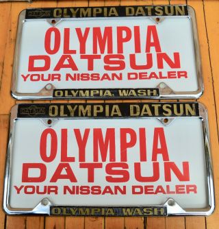 Set 2 Vtg Embossed Metal License Plate Frame,  Inserts Olympia Datsun Nissan Wa