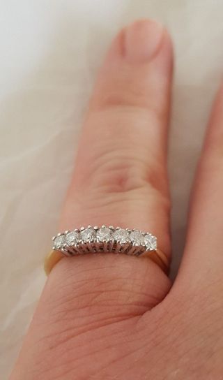 An 18ct White & Yellow Gold half Eternity Ring.  Set with Brilliant cut Diamonds 10