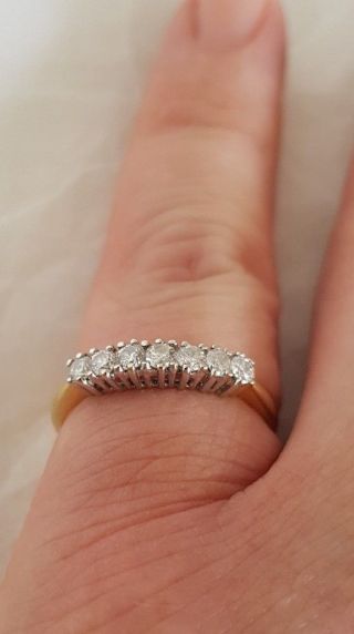 An 18ct White & Yellow Gold half Eternity Ring.  Set with Brilliant cut Diamonds 11