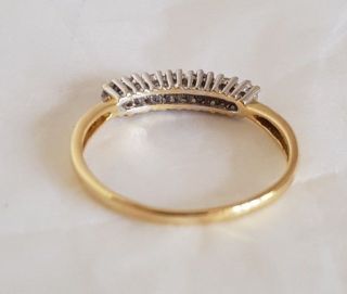 An 18ct White & Yellow Gold half Eternity Ring.  Set with Brilliant cut Diamonds 5