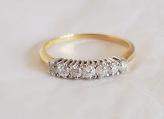 An 18ct White & Yellow Gold half Eternity Ring.  Set with Brilliant cut Diamonds 6