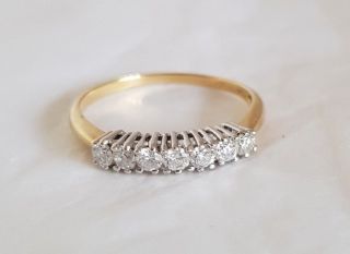 An 18ct White & Yellow Gold half Eternity Ring.  Set with Brilliant cut Diamonds 9