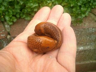 Hand Carved wood netsuke fish pair swim in circle collectable boxwood figure.  2 2