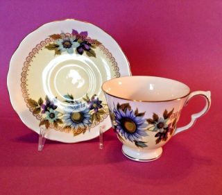 Queen Anne Pedestal Teacup And Saucer - White Green Blue And Purple - England