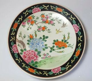 A Large Chinese Qing Dynasty Famille Noire Plate.  Peony And Peaches.