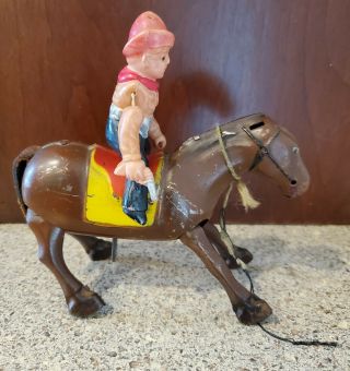 Occupied Japan Tin And Celluloid Cowboy On Horse Wind - Up Toy