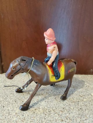 Occupied Japan Tin and Celluloid Cowboy on Horse Wind - up Toy 4
