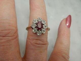 A 9 CT GOLD LARGE RUBY AND DIAMOND CLUSTER RING 7