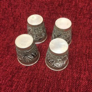 A set of FOUR old (antique?) Solid Silver Cups,  oriental motiffs 7