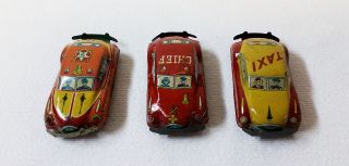 Three Vintage 2 - Inch Tin Toy Cars Gmen,  Yellow Taxi,  Fire Chief