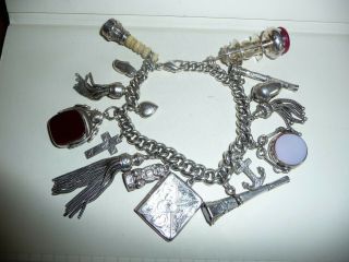 P/w Chain As A Bracelet With 2 Spinners 3 Tassels 2 Seals 2 Pencils,  7 Others