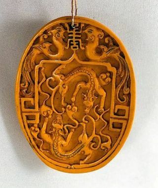 Unusual Vintage Chinese Hand Carved Yellow Pendant Medallion Fighting Dragons