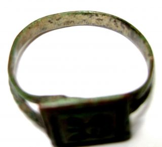 Ancient Medieval bronze finger ring with flower on bezel. 7