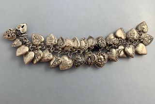 Vintage Sterling Puffy Hearts Bracelet With 28 Charms And 1 Walter Lample Charm