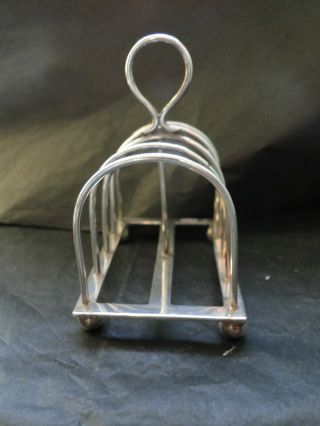 SMALL TOAST RACK ON 4 BALL FEET MADE IN STERLING SILVER IN SHEFFIELD 1934 2