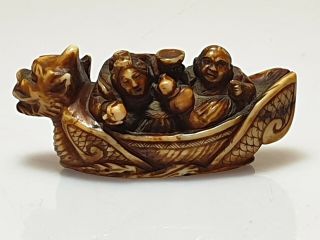 A Fine Edo Period Netsuke Of A Dragon Boat with Two Figures. 11