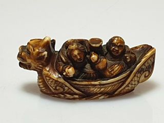 A Fine Edo Period Netsuke Of A Dragon Boat With Two Figures.