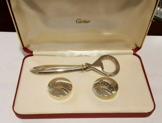 Cartier Sterling Silver Bottle Opener And Two Bottle Caps With Cartier Case