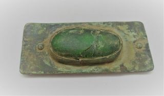 Detector Finds Ancient Viking Belt Mount With Green Stone Insert