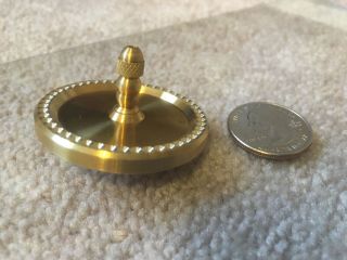 Brass spinning top with ceramic bearing and index drill design (over 7 min spin) 3