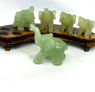Chinese Hand Carved Jade Elephant Figurine Set Of 5 On Matching Wood Stand.