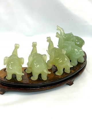 Chinese hand carved Jade elephant figurine set of 5 on matching wood stand. 5
