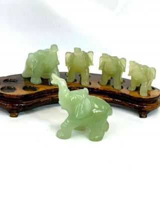 Chinese hand carved Jade elephant figurine set of 5 on matching wood stand. 8