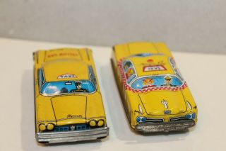 TWO VINTAGE TIN LITHO FRICTION POWERED PLYMOUTH YELLOW & CHECKER TAXI CABS 3