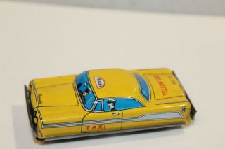 TWO VINTAGE TIN LITHO FRICTION POWERED PLYMOUTH YELLOW & CHECKER TAXI CABS 5