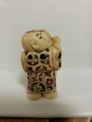 Netsuke Figurine - Old man with vase and bell 4