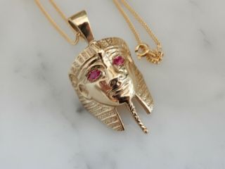 A Fabulous 9 Ct Gold Ruby Pharaoh Head Pendant And Chain