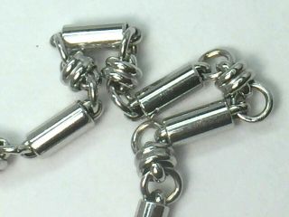 CHARMING 14K white gold fancy KNOT & ROD link bracelet.  6 - 3/8 