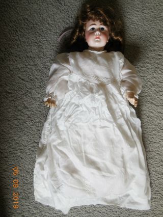 1889 French Doll Porcelain Head? And Wood Legs? About 17 Inches Long.