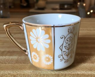 VINTAGE TEACUP AND SAUCER ORANGE,  WHITE AND GOLD 2