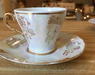 VINTAGE TEACUP AND SAUCER RAISED GOLD PATTERN ON CUP AND SAUCER 2