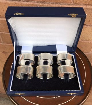 A Good Quality Boxed Set Of Six Solid Sterling Silver Napkin Rings,  Birm 2003.