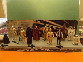 12 Vintage Star Wars Figures W/ Display Stand,  Backer,  Guns